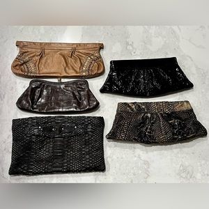 5  genuine chic leather clutch purses for sale. Each in excellent condition.